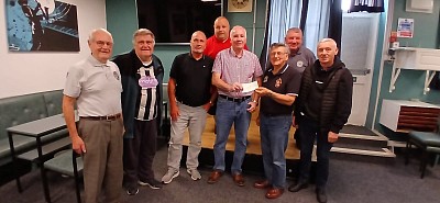 Walking Football Club receive cheque for £600 from Supporters Club Treasurer Ernie Hamer